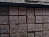 many boxes stacked on top of each other on the back of a truck
