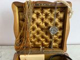 a box with a bunch of jewelry inside of it