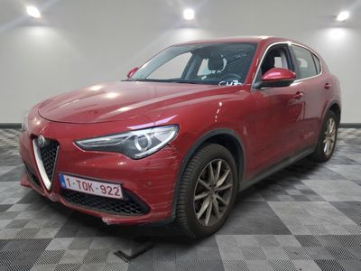 the red alfa suv is parked on a checkered floor