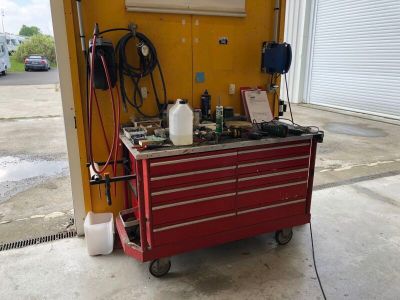 an image of a garage with a work bench and tools