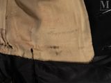 a piece of cloth that has been torn off of a jacket