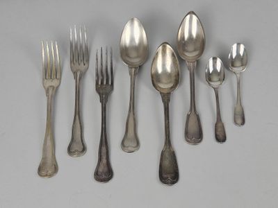 a lot of silver spoons and forks on the table