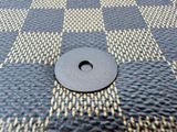 a close up of a black and white checkered table cloth