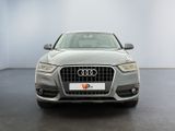 the front view of a silver audi car parked in a showroom