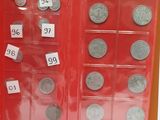 a lot of coins that are in a red box