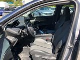 the interior of a car with the door open and the driver ' s seat down