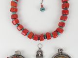 three pieces of jewelry including a necklace, bracelet, and a watch