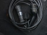 a black cord in the center of a car seat