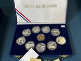 a box of six coins with a picture of a woman on it