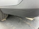 a close up of a car ' s front bumper and tire