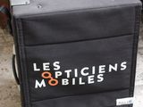 a black suitcase sitting on top of a cart on the floor