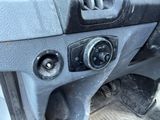 a close up of a car ' s dashboard with a clock on it