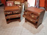 two wooden drawers and a chest of drawers in a room