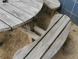 a wooden table with two benches next to it