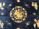 an image of a blue area rug with oriental designs on it