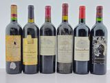 plusieurs bouteilles de vin sont alignées sur une table