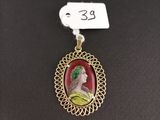 a picture of a necklace with a picture of a woman on it