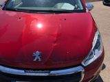 a red car that is parked in a parking lot