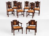 quatre chaises à dossier et accoudoirs sculptés, dont l'une avec une assise sculptée et l'autre avec un dossier sculpté