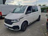 the white van is parked in the parking lot next to other vans