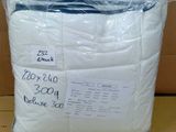 a bag of toilet paper sitting on top of a cardboard box