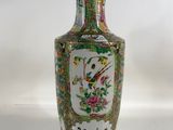 a vase that is sitting on a white surface