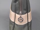 grey and pink handbag on a grey background