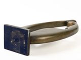 brass and lapis ring with a blue lapis stone in the center