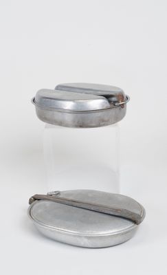 pair of silver plated containers with lids on white surface