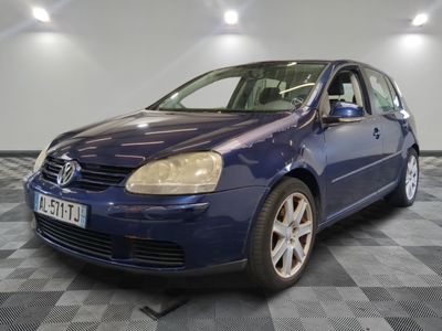 a picture of a blue car parked in a garage
