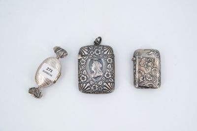 three pieces of silver jewelry including a locke, a watch and a pendant