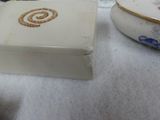 a white box with a design on it sitting on a table