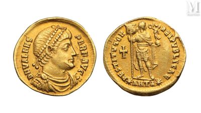 a gold coin with an image of a man holding a sword