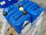 several blue plastic containers are stacked on top of a pallet in a warehouse