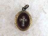a close up of a small locke with a cross on it