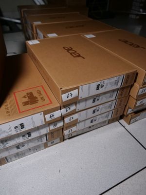 many boxes stacked on top of each other on the floor