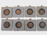 six different types of coins are shown in a row on a white surface