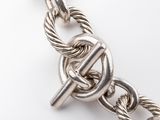 an image of a close up of a chain bracelet with a clasp