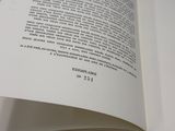 a book open to a page of text on a table