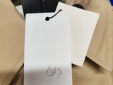a picture of a shirt with a tag attached to it