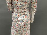 an image of a mannequin dressed in a floral print dress