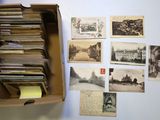 a box full of old postcards sitting on a table