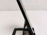 a cell phone that is sitting on top of a stand