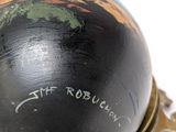 a close up of a globe on a stand