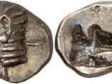 une pièce de monnaie en argent portant l'image d'un homme et d'une femme