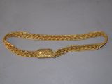 a gold chain belt with a clasp on it