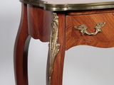 a small table with a drawer on top of it