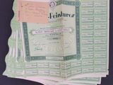 several green and white certificates are stacked on top of each other