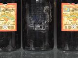 six bottles of wine are lined up in a row