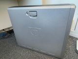 a computer that is sitting on the floor in the room